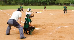 Hannah Philpot connects with a high pitch to slug a hard line drive into left field after racking up a full count in the bottom of the second inning of the Lady Raiders’ Sept. 2 match. The hit resulted in a single for Philpot.