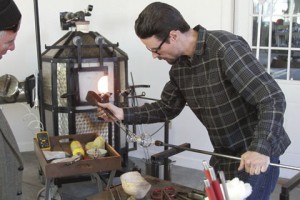 Warner Robbins-based glassblower, Chris Fiertner, gives a demonstration of the mobile unit’s capabilities during Mobile Glassblowing, LLC’s Open House on Dec. 19 in Americus.